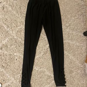 Black leggings with cross holes at bottom